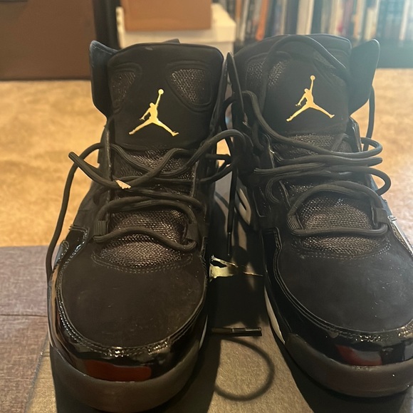 Brand New Black and Gold Jordan 6.  Size 9